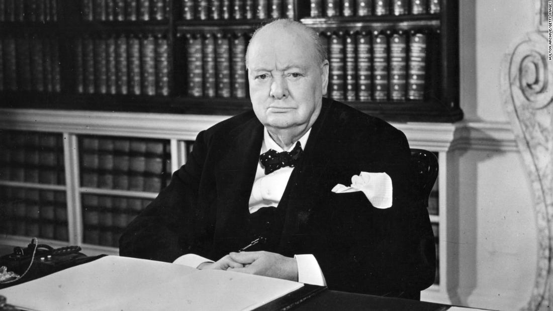 British prime minister Sir Winston Leonard Spencer Churchill (1874 - 1965) sitting at his desk.