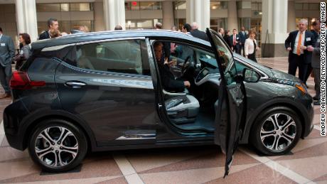 A man looks at a Chevrolet Bolt before attending a winter luncheon with Mary T. Barra, Chairman and CEO of General Motors Company in Washington, DC on February  28, 2017. / AFP / Andrew CABALLERO-REYNOLDS        (Photo credit should read ANDREW CABALLERO-REYNOLDS/AFP/Getty Images)