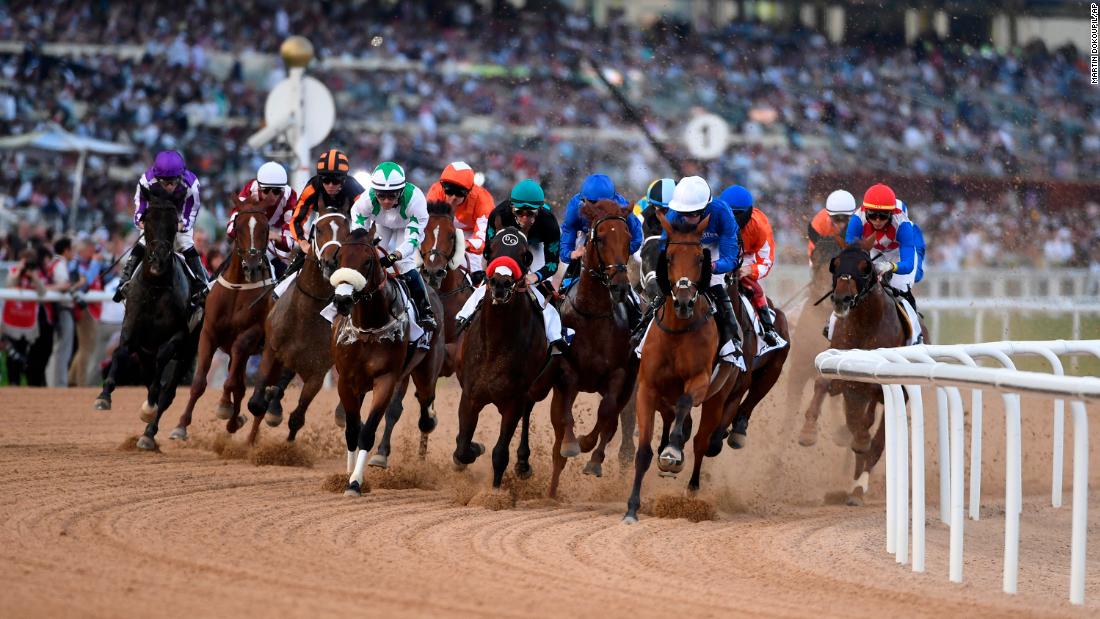 Horses gallop into the first turn in the $2.5-million Group 2 UAE Derby over 1900m in Dubai.