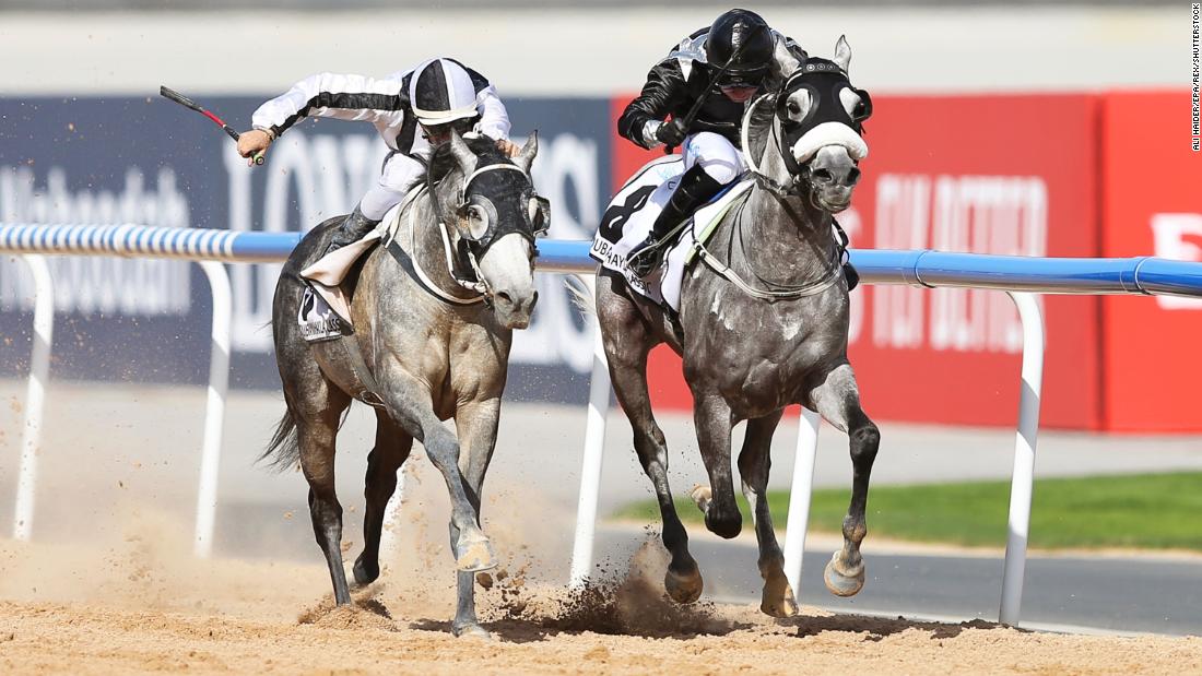 Jockey Tadhg O&#39;Shea, right, rides AF Maher on the way to winning the Dubai Kahayla Classic race during the Dubai World Cup 2019 at the Meydan Racecourse in Dubai.