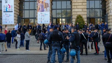 Riot police stand alert outside the World Congress of Families venue in the ancient city&#39;s Piazza Bra as a neo-fascist leader delivered a press conference outside.