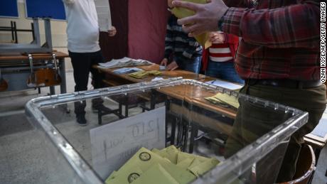 Electoral officers count ballots at a polling station in Istanbul on March 31.