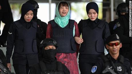 Vietnamese national Doan Thi Huong (C) is escorted by Malaysian police out of the High Court in Shah Alam on April 1, 2019. - A Vietnamese woman accused of assassinating the North Korean leader's half-brother will walk free in May after pleading guilty to a lesser charge, her lawyer said. (Photo by Mohd RASFAN / AFP)        (Photo credit should read MOHD RASFAN/AFP/Getty Images)