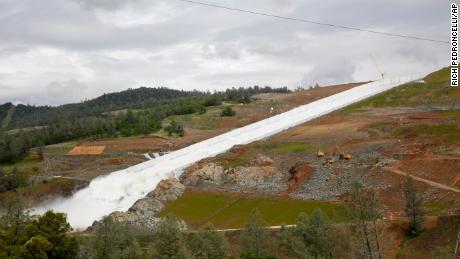 Water flows down the Oroville Dam spillway on April 2, 2019. California officials opened the flood-control spillway at the nation&#39;s tallest dam for the first time since it crumbled during heavy rains two years ago. 