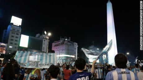 Racing Club fans celebrate at the Obelisk in Buenos Aires.