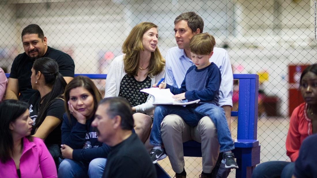 O&#39;Rourke and his wife sit with their son Ulysses as they watch their daughter, Molly, play volleyball in February 2017.