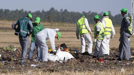 Investigators collect personal effects and other materials from the crash site of Ethiopian Airlines Flight 302.