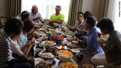 Dr. Sanjay Gupta joins a family meal in Okinawa, Japan.