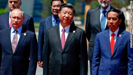 Russian President Vladimir Putin, Chinese President Xi Jinping,  Indonesia's President Joko Widodo and other delegation heads pose for a group photo as they attend the Belt and Road Forum for International Cooperation at the Yanqi Lake venue on May 15, 2017, on the outskirts of Beijing, China.