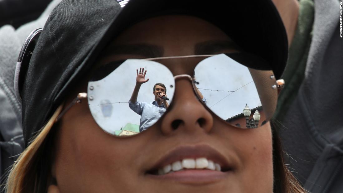 O&#39;Rourke is reflected in a supporter&#39;s sunglasses as he speaks during a campaign rally in El Paso in March 2019.