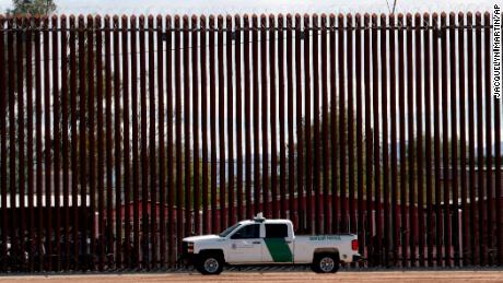 A U.S. Customs and Border Protection vehicle sits near the wall as President Donald Trump visits a new section of the border wall with Mexico in Calexico, Calif., Friday April 5, 2019. (AP Photo/Jacquelyn Martin)