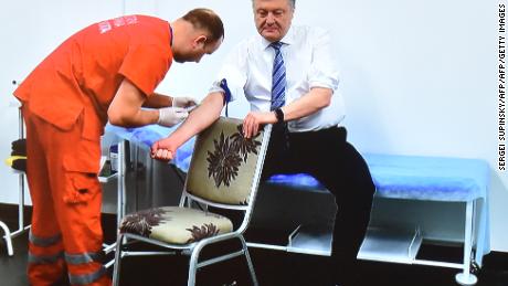 Ukraine President takes drug test before debating comedian in 70,000-seater stadium