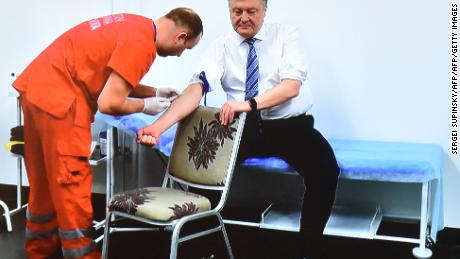 Ukraine President takes drug test before debating comedian in 70,000-seat stadium