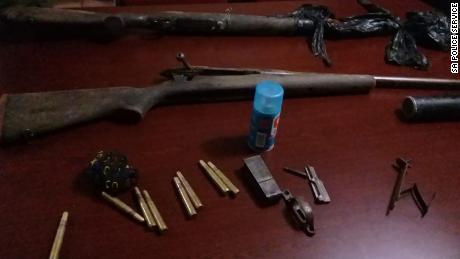 Police say they arrested three men and seized guns following the alleged poacher&#39;s death. 