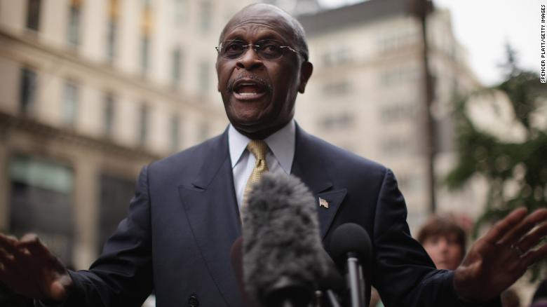 Trump stands by controversial Fed pick Herman Cain