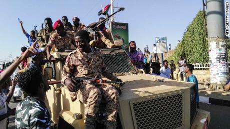 Sudanese troops move to protect anti-government protesters in Khartoum