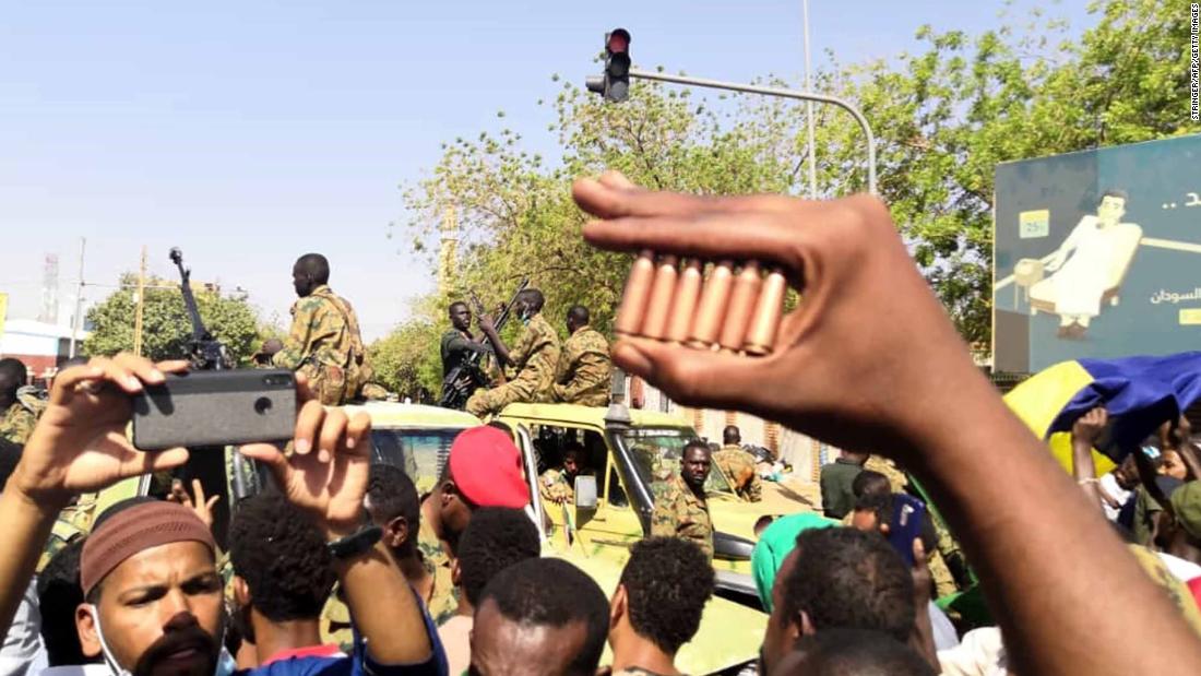 A protester shows bullet cartridges during an April 8 demonstration.