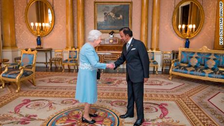 Britain&#39;s Queen Elizabeth II meets the sultan of Brunei at Buckingham Palace in 2017.