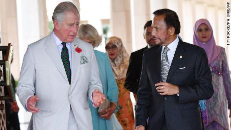 Britain&#39;s Prince Charles walks with the sultan of Brunei as they attend a high tea at the sultan&#39;s palace in Bandar Seri Begawan, Brunei, in 2017.