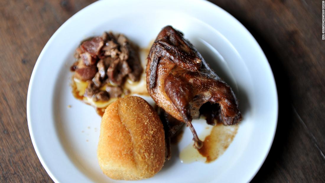 This is fried Quail partnered with minced chicken liver, bacon and bread. 