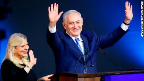 Israeli Prime Minister Benjamin Netanyahu greets supporters with his wife Sara at his Likud Party headquarters in the Israeli coastal city of Tel Aviv on election night early on April 10, 2019. (Photo by Jack GUEZ / AFP)        (Photo credit should read JACK GUEZ/AFP/Getty Images)