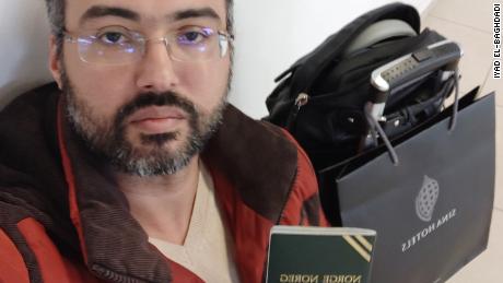 Iyad El-Baghdadi shows his Norwegian travel document after being denied boarding by Ryanair.  