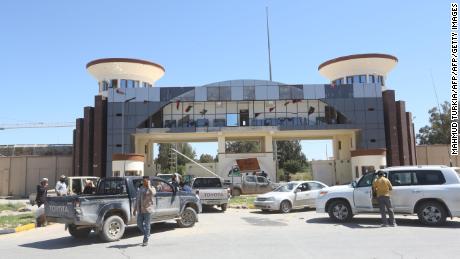 Gun-mounted vehicles belonging to fighters loyal to the internationally recognised GNA are pictured near a military compound in a suburb of Tripoli.