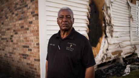 Greater Union Baptist Church Pastor Harry Richard stands for a portrait in front of the ruins of his church building in Opelousas, Louisiana.