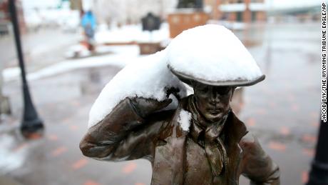 Snow rests on the brim of the cowboy hat on the sculpture &quot;Buster&quot; by Bobby Carlyle.