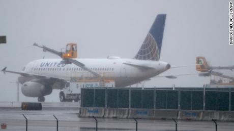 A United Airlines plane is deiced before taking off from Denver International Airport on Wednesday. 