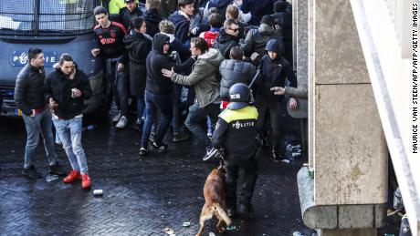 Dutch police officers surround Ajax&#39;s supporters ahead of the match. 