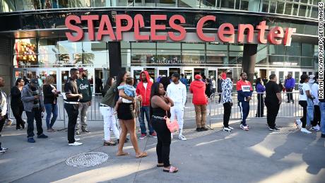 People arrive for Thursday's memorial service for Nipsey Hussle at the Staples Center in Los Angeles.