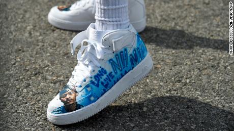 Slum Baby, who hails from Nipsey&#39;s Crenshaw District, wore shoes paying tribute to the rapper. 