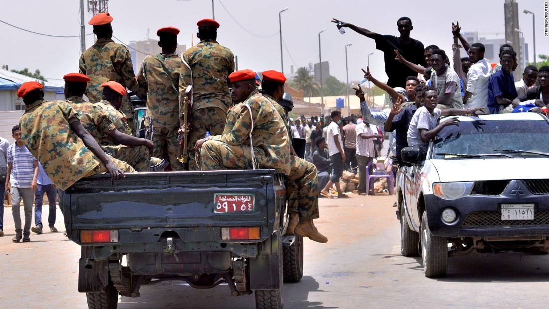 Demonstrators cheer on April 11,  after an announcement that Bashir had been detained &quot;in a safe place.&quot;