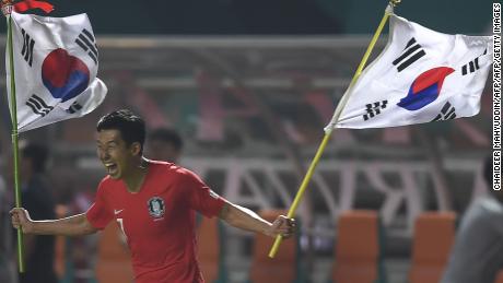 South Korea&#39;s forward Heung Min Son celebrates after winning gold at the 2018 Asian Games.