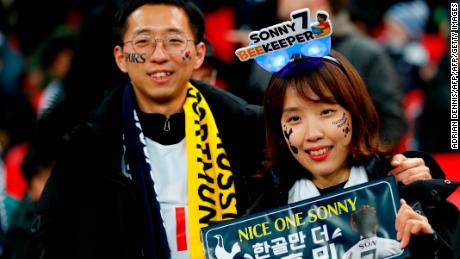 Two fans of Tottenham Hotspur&#39;s South Korean striker Son Heung-Min await their hero.