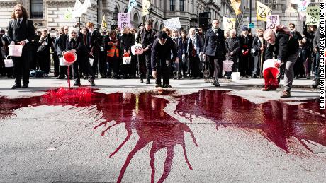 Extinction Rebellion activists threw 200 liters of fake blood outside Downing Street in March 2019. 