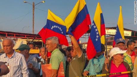 Current and former workers of Venezuelan state oil company PDVSA protest outside of the Las Salinas oil field. 