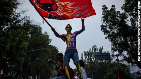 A supporter of Indonesian incumbent Presidential candidate Joko Widodo attends a campaign rally at the Sriwedari stadium in Solo, Central Java on April 9.