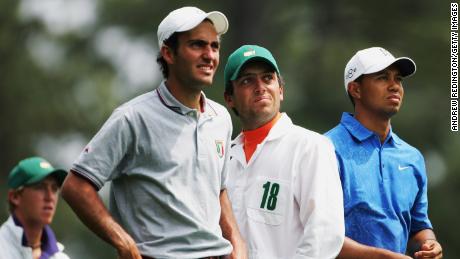 Francesco Molinari (center) caddies for brother Edoardo (left) with Tiger Woods in the 2006 Masters.