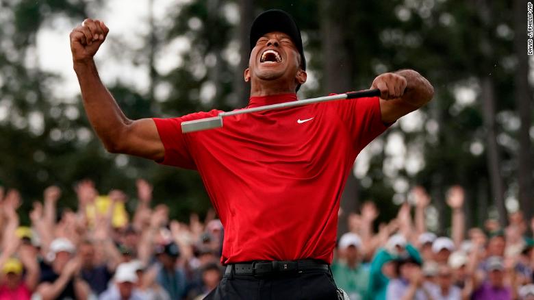 Tiger Woods punched the air to tumultuous applause and chants of &quot;Tiger, Tiger&quot; as he sealed his 15th major title.