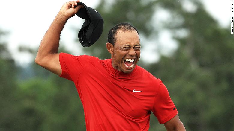 Woods celebrates after sinking the putt that clinched a fifth Masters title -- 14 years after his last.