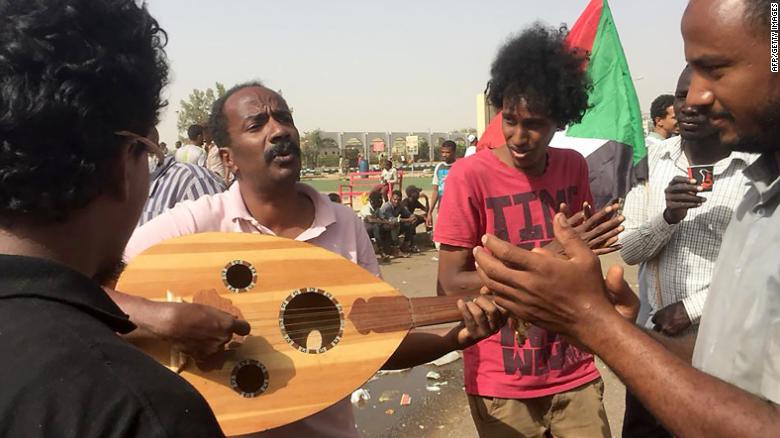 Demonstrators play music in Khartoum.