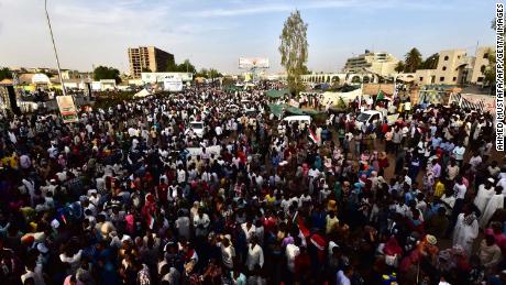 Sudanese demonstrators gather near the military headquarters in the capital Khartoum on April 14, 2019.