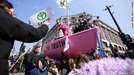 A pink sailboat with the message &#39;Tell the truth&#39; blocks Oxford Circus. 