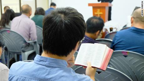 A Chinese Christian reads a Bible at a church in Nairobi.