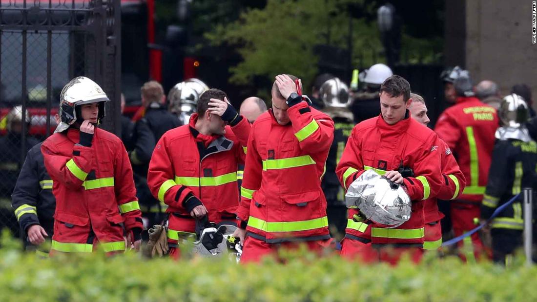 Firefighters exit Notre Dame Cathedral on April 16, 2019.