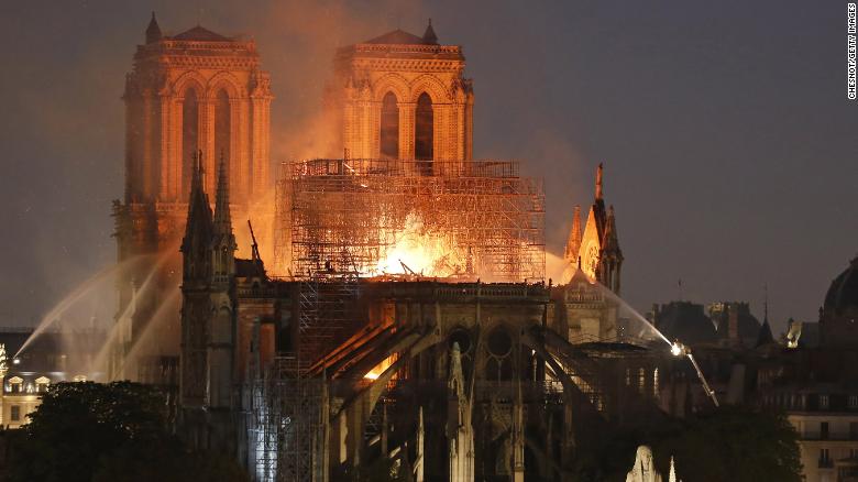 Fire caused Notre Dame&#39;s spire to collapse as people watched on horrified. 