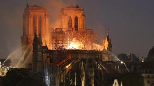 PARIS, FRANCE - APRIL 15: Flames and smoke are seen billowing from the roof at Notre-Dame Cathedral on April 15, 2019 in Paris, France. A fire broke out on Monday afternoon and quickly spread across the building, collapsing the spire. The cause is yet unknown but officials said it was possibly linked to ongoing renovation work. (Photo by Chesnot/Getty Images)