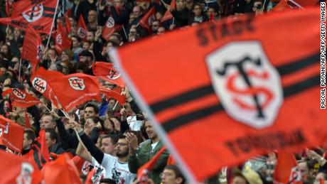 Stade Toulousain&#39;s supporters wave flags during the French Top 14 rugby union match Toulouse against Clermont on April 14, 2019 at the Municipale Stadium in Toulouse, southern France. (Photo by PASCAL PAVANI / AFP)        (Photo credit should read PASCAL PAVANI/AFP/Getty Images)